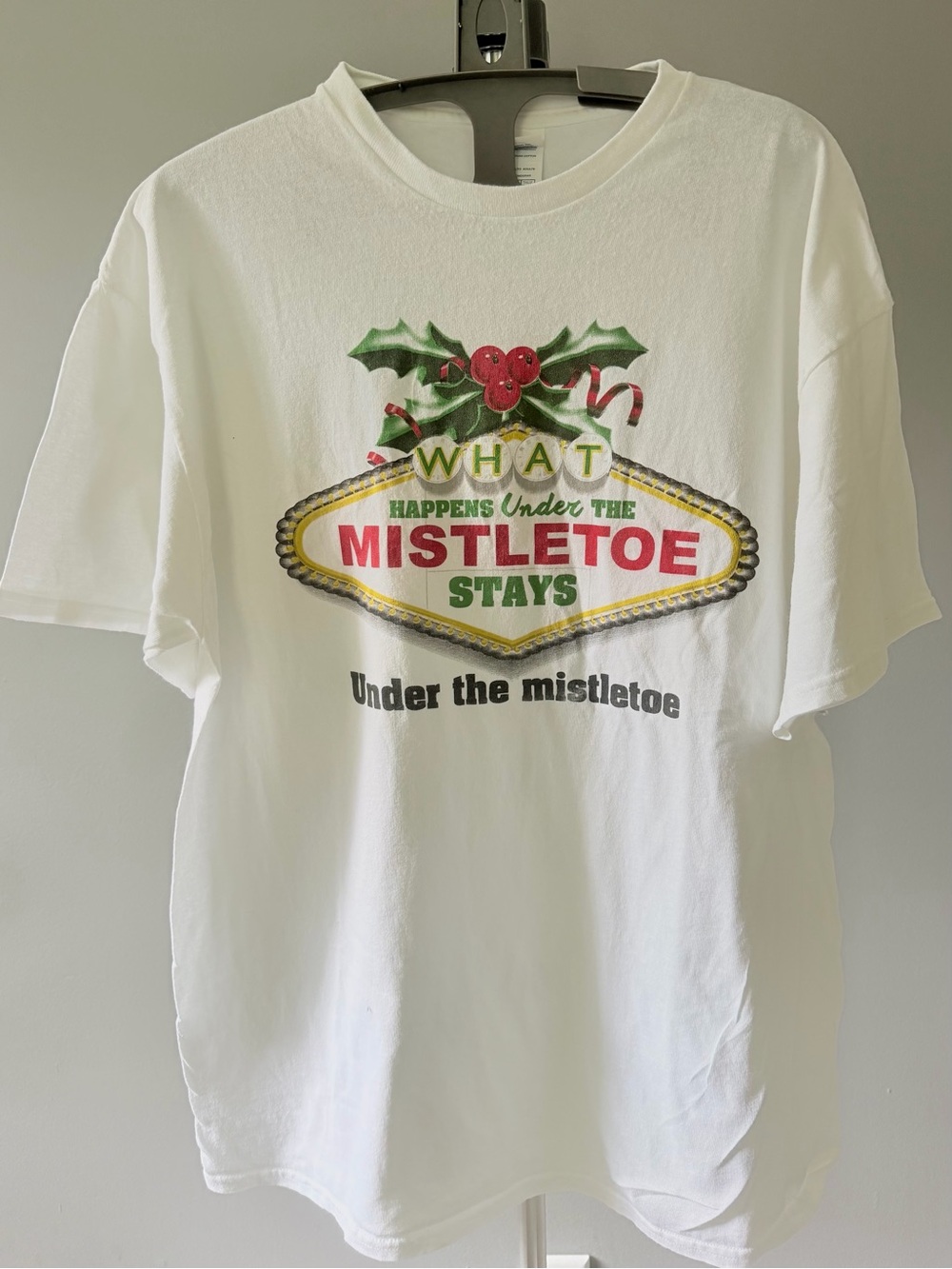Holiday What Happens Under the Mistletoe Shirt